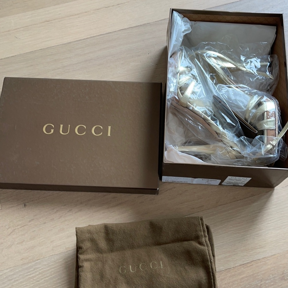 Gucci. Gold, strapping, leather sandals with cork bottom